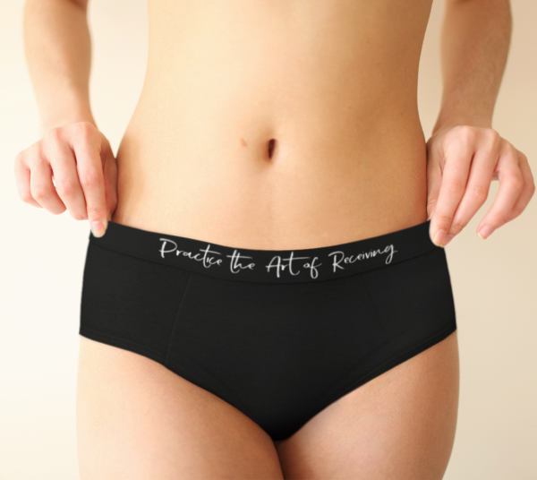 Underwear with text 'Practice the Art of Receiving' written on the band